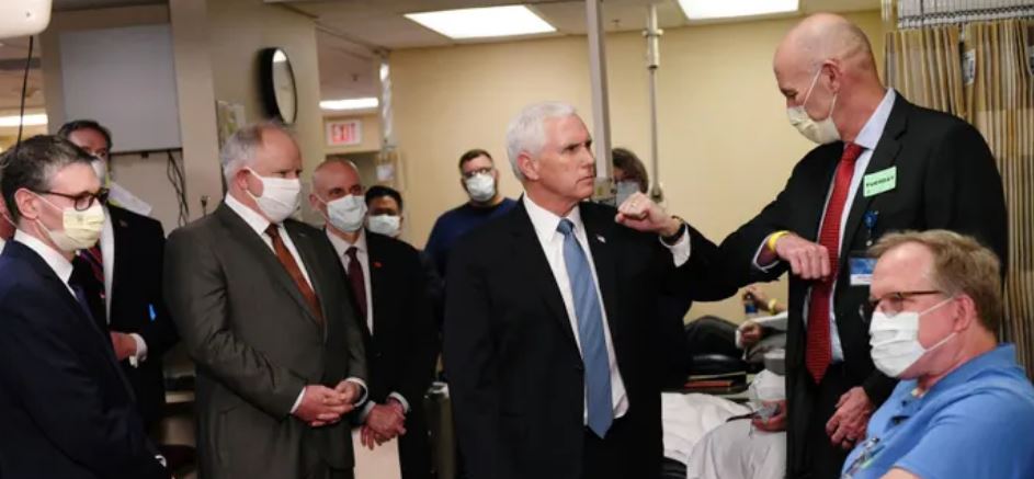 Mike Pence shuns face mask on visit to hospital